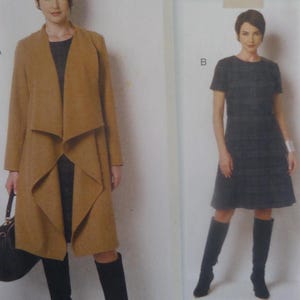May include: A tan open-front coat with a draped collar and long sleeves, paired with a dark gray knee-length dress featuring a subtle plaid pattern, black knee-high boots, and a black handbag, alongside a dark gray plaid short-sleeve dress.