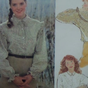 May include: A long-sleeved blouse featuring a light-colored plaid pattern, a high collar with a tie detail, button-down front, and ruffled shoulders and cuffs. The blouse is paired with a dark belt and a solid-colored skirt, shown alongside illustrations.