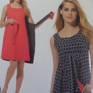 May include: A sleeveless red dress with a square neckline and a matching belt. The dress is paired with a patterned shawl featuring a black and white floral design. Another dress is shown with a navy blue floral pattern.