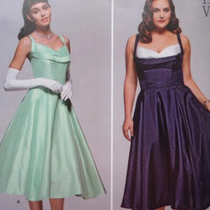May include: Two sleeveless dresses with full skirts and fitted bodices. The left dress is light green with a folded neckline and white elbow-length gloves. The right dress is dark purple with a white sweetheart neckline insert and wide straps.