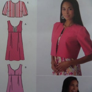 May include: A sewing pattern featuring three dress designs and a bolero jacket. The dresses include a polka-dot print and a solid pink option. The bolero is a solid pink color with three-quarter sleeves. The image also shows a woman wearing a pink bolero.