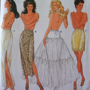May include: Illustration of four different skirt designs. The skirts include a cream-colored skirt with a high slit, a floral print skirt, a tiered white skirt, and a yellow skirt with lace trim. The models are shown from the waist down.