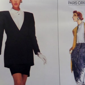 May include: A vintage fashion illustration featuring a woman in a black blazer dress with a white collared shirt underneath. The blazer has prominent shoulder pads. The illustration is from a "Paris Original" design.