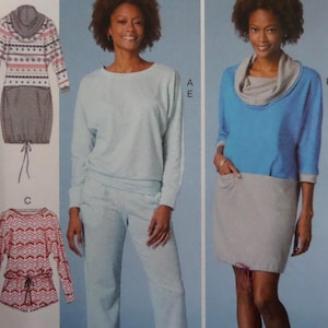 May include: Image of a woman modeling three different outfits. The outfits include a light blue sweatshirt and matching pants, a blue top with a gray cowl neck and skirt, and a patterned dress with a gray skirt. The outfits are casual and comfortable.