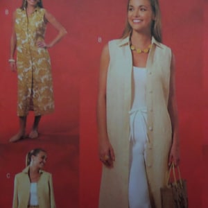 May include: A sleeveless, button-down, long beige dress with a collar. The dress is worn over a white outfit. The image also shows a similar dress with a floral pattern in shades of yellow and brown. A beige blazer is also shown.