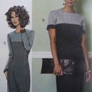 May include: Image of a fashion illustration featuring two dresses. One dress is a long-sleeved design with a gray top and a black and white checkered pattern on the lower half. The other dress is a short-sleeved design with a gray top and a black bottom.