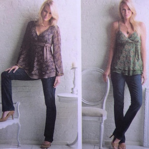 May include: Two women's outfits are displayed. One features a dark floral print blouse with long sleeves and a tie waist, paired with dark wash jeans and heels. The other outfit includes a green floral print camisole, dark wash jeans, and heels. Both outfits are casual and stylish.