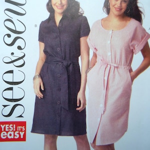 May include: Two dresses are shown. One is a dark blue button-down dress with a belt. The other is a pink button-down dress with a belt. The dresses have short sleeves and are knee-length. The text "YES! IT'S EASY" is visible.