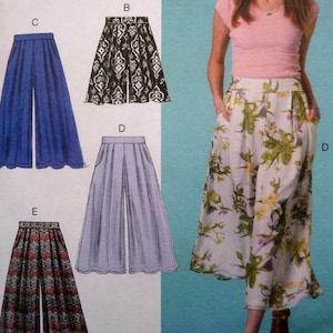 May include: A woman wearing floral print palazzo pants with pockets. The image also shows a pattern for palazzo pants in blue, black and white, and patterned fabrics. The pants have a wide leg design.