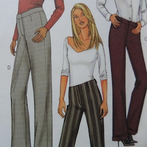 May include: A sewing pattern illustration featuring three different styles of trousers. One pair is light gray with a herringbone pattern, one pair has vertical dark stripes, and the third pair is solid dark brown with a cuffed hem design.