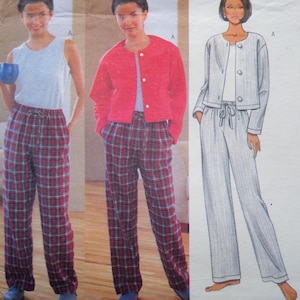 May include: A sewing pattern envelope featuring three variations of loungewear: a light gray tank top with red plaid pants, a bright red button-up jacket with red plaid pants, and a light gray long-sleeve jacket with matching light gray pants.