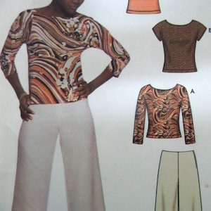 May include: A woman wearing a long-sleeved top with a swirling pattern in shades of brown, orange, and white, paired with white wide-leg pants. The image also shows a pattern for similar tops and pants.