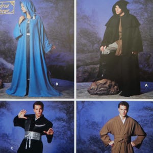 May include: Image of a pattern for various hooded robes and cloaks. The designs include a long blue cloak with white trim, a black hooded cloak, a black kimono-style outfit, and a brown robe with a belt. The pattern is labeled "Andrea Schewe".