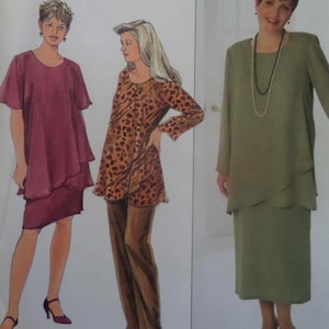 May include: A sewing pattern illustration featuring three outfits: a layered plum dress with short sleeves, a long-sleeved leopard print tunic paired with brown trousers, and a long-sleeved sage green dress with a layered bodice and a long necklace.