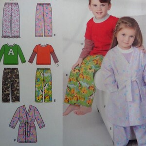 May include: Image of children's clothing patterns, including pajamas, shirts, and a robe. The patterns feature floral, animal, and camouflage prints. A boy and girl are wearing pajamas. The boy is wearing a red shirt and green animal print pants. The girl is wearing a light purple robe and pants.