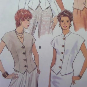 May include: A sewing pattern illustration featuring two sleeveless vests. The left vest is beige with a V-neck and four buttons. The right vest is white with a mandarin collar and five buttons. Both garments have short cap sleeves and a fitted waist.
