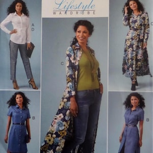 May include: A sewing pattern envelope titled Lifestyle Wardrobe featuring illustrations of various garments including a white button-down shirt, patterned trousers, a floral duster coat, a solid olive green top, blue jeans, and two blue denim shirt dresses.