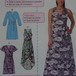 May include: A sewing pattern featuring four dress designs. The dresses include a wrap dress, a sleeveless floral dress, and two other wrap-style dresses. The pattern also includes instructions in multiple languages, including French and Spanish.