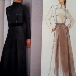 May include: A long-sleeved, floor-length dress featuring a double-breasted bodice with six buttons, a high collar, and a wide waistband. The garment is shown alongside a fashion illustration depicting a similar two-piece outfit with a jacket and skirt.