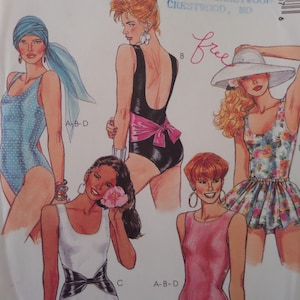 May include: A sewing pattern envelope illustration featuring five different swimsuit designs. The styles include a blue polka dot one-piece, a black one-piece with a pink sash, a floral print swimsuit with a skirt, a white one-piece with a black waist detail, and a solid pink one-piece.