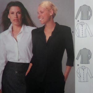 May include: A sewing pattern envelope featuring a white long-sleeve button-down shirt and a black pinstriped blazer with three-quarter length sleeves. The pattern includes technical line drawings labeled A and B showing front and back views.