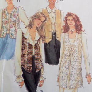 May include: A sewing pattern illustration featuring four distinct vest designs. One vest has a floral print, another is solid tan, one is a multi-colored textured fabric with a ruffled blouse, and the last is a long, white, embroidered sleeveless duster.