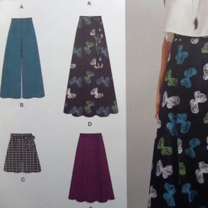 May include: A sewing pattern illustration featuring four garment designs: teal wide-leg trousers, a black skirt with a white, blue, and green butterfly print, a black and white plaid culotte, and a solid purple skirt, all with scalloped hems.