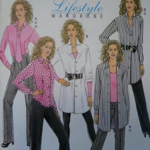 May include: A sewing pattern envelope titled Lifestyle Wardrobe featuring illustrations of four outfits. The designs include a pink shirt with a tie, a pink polka dot shirt, a white shirt dress, and striped shirts, all paired with trousers and belts.