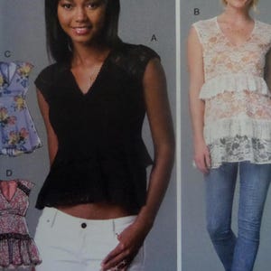 May include: A black cap-sleeve top with a V-neck and peplum detail. The image also shows a white lace top with a V-neck and tiered ruffles, and two floral print tops with lace trim.