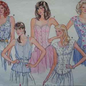May include: Vintage sewing pattern featuring illustrations of women's clothing designs. The designs include a pink corset top, a blue and white striped top, and a floral print top. The illustrations are in a retro style, with detailed drawings of the garments.