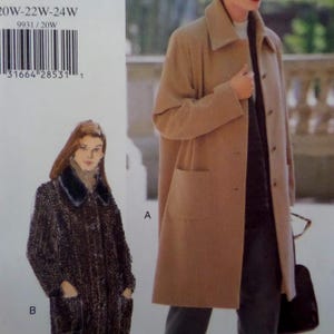 May include: A sewing pattern envelope featuring two coat styles: a solid tan knee-length coat with a collar and front pockets labeled A, and a dark patterned textured coat with a dark collar and front pockets labeled B. Text includes 20W-22W-24W 9931/20W.