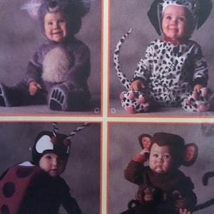 May include: A sewing pattern sheet featuring four infant costumes: a fuzzy purple koala suit, a white and black spotted dalmatian jumpsuit with a tail, a red and black ladybug outfit with antennae, and a brown textured monkey costume with ears.