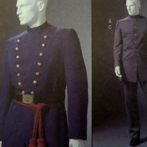 May include: Navy blue military-style uniform jacket with gold buttons and a red sash. The jacket has a high collar and is paired with matching pants. A black belt with a gold buckle completes the look. The uniform is displayed on a mannequin.