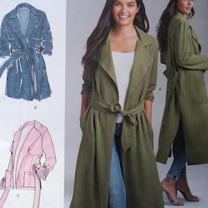May include: An olive green trench coat with a tie belt, shown on a model. The coat has a long, flowing design with a shawl collar and pockets. The image also includes illustrations of similar coats in blue and pink.