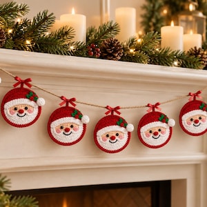 May include: A festive garland featuring seven circular crocheted Santa Claus ornaments strung on a natural twine cord. Each ornament is red and white with a smiling face, a small red bow at the top, and a tiny green holly leaf accent.