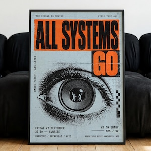 May include: A rectangular poster with a light blue background featuring a large black and white eye illustration. The text reads ALL SYSTEMS GO in bold orange and black. Inside the pupil are two small figures. Additional text includes event details.