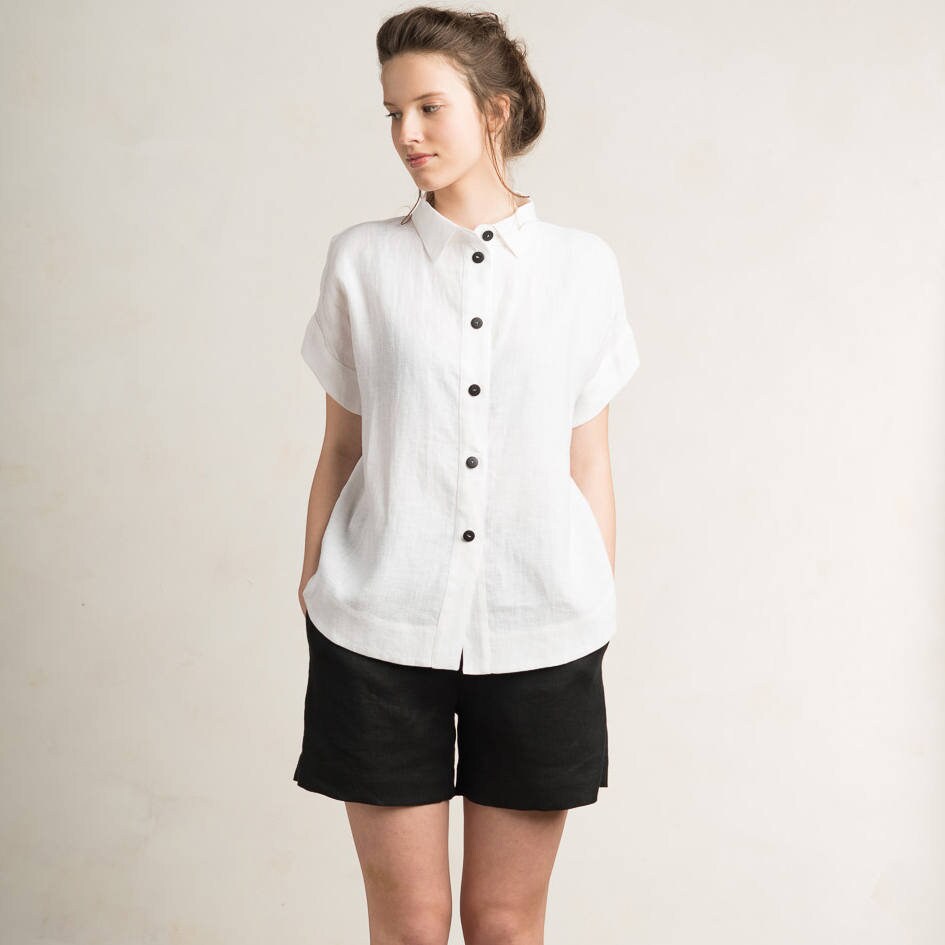 white blouse black buttons