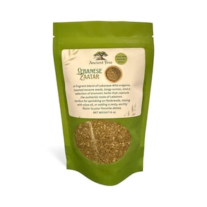 May include: A green pouch of Ancient Tree Lebanese Zaatar spice blend. The label includes text describing the blend of oregano, sesame seeds, sumac, and herbs. The net weight is 170 grams.