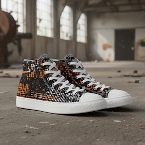 May include: High-top sneakers with a black, white, and orange dot pattern. The shoes have white laces and soles. The sneakers are on a concrete surface.