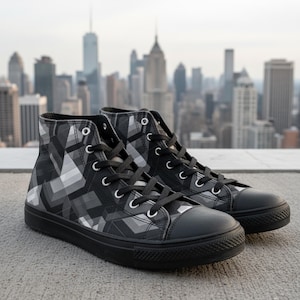 May include: A pair of high-top sneakers with a black and gray geometric pattern. The shoes have black laces, a black toe cap, and a black sole. The background features a cityscape.