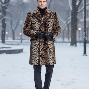 May include: A double-breasted leopard print coat with black trim and a black turtleneck. The coat is knee-length and worn with black gloves, pants, and shoes. The background is a snowy park.