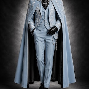 May include: A light blue suit featuring a matching floor-length cape with silver embroidery, a vest, and trousers. The ensemble includes a black shirt, a black tie, black gloves, and black shoes. Silver chains connect the cape and vest.
