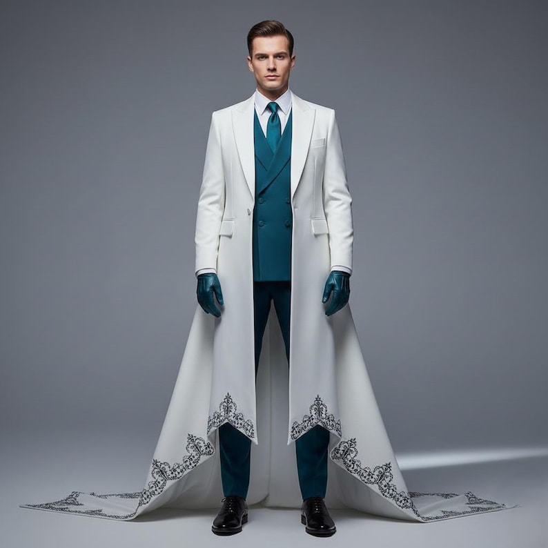 May include: A formal white coat with a long train and intricate black embroidery at the hem. The coat is worn over a teal suit with a matching tie and gloves. Black dress shoes complete the look.