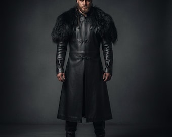 May include: A long, black leather coat with a fur collar. The coat has a button-down front and is worn with black boots. The image is set against a dark grey background, highlighting the coat's details and texture.
