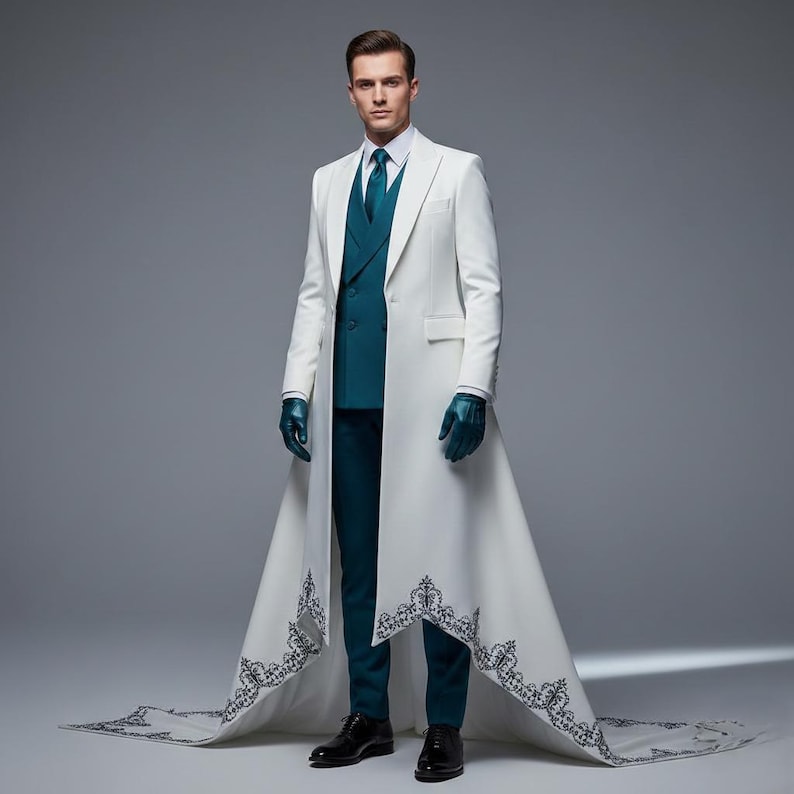 May include: A formal white overcoat with a long train, featuring intricate black embroidery along the hem. The coat is worn over a teal suit, complete with a vest, tie, and gloves. Black dress shoes complete the ensemble.