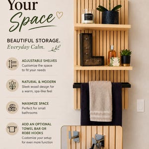 May include: A spa-inspired wooden wall shelf unit with adjustable shelves, a towel bar, and robe hooks. The shelves display candles, plants, and decorative items. The unit is designed to maximize space and create a spa-like feel.