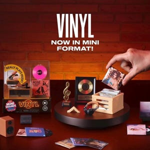 May include: A Mini Brands Vinyl set featuring a miniature record player, a gold record award, a treble clef trophy, headphones, and a crate filled with tiny album covers. The packaging displays the text VINYL NOW IN MINI FORMAT!