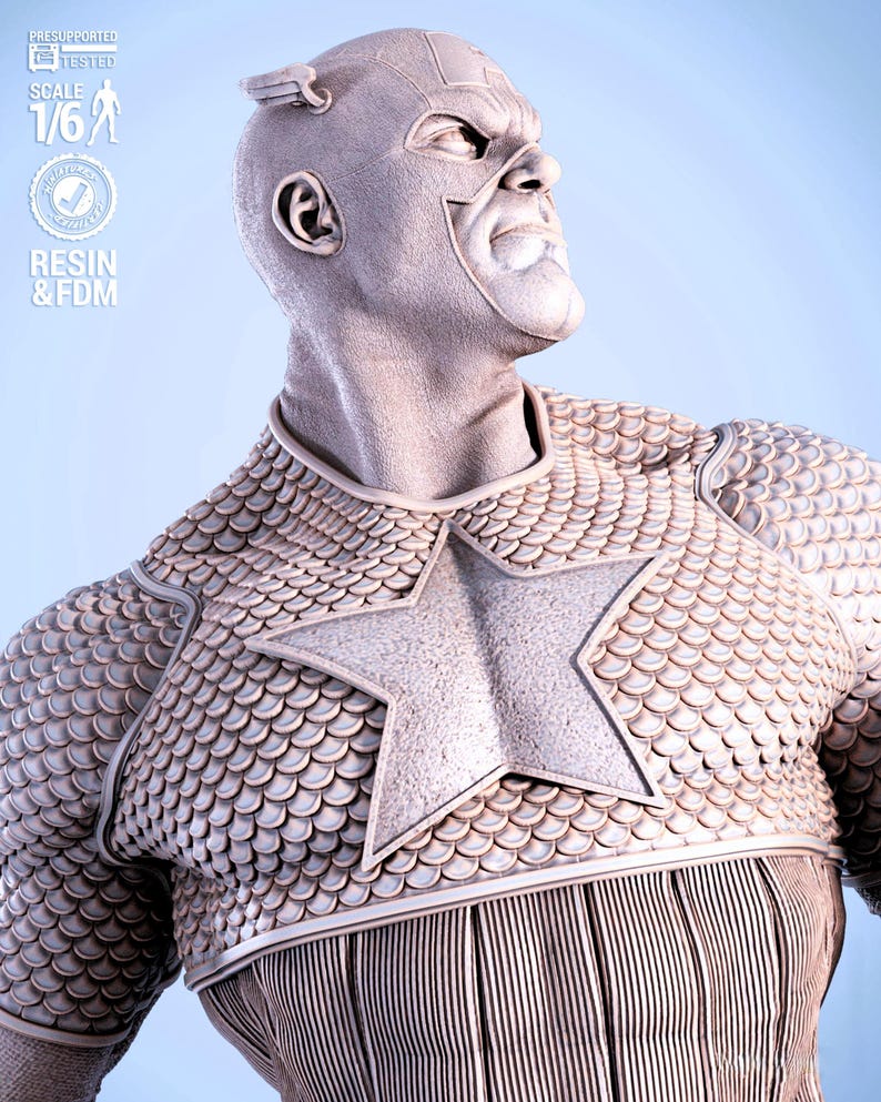May include: A gray, detailed statue of a superhero figure, featuring a star emblem on the chest and scale-like armor. The figure is wearing a mask and has a determined expression. The image includes text indicating scale and material.