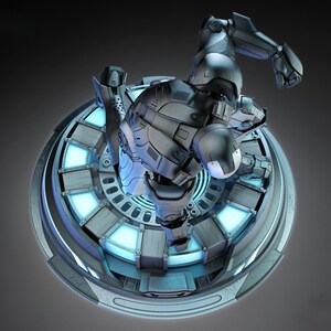 May include: A detailed, gray and black action figure of a superhero in a dynamic pose, mounted on a circular platform with glowing blue accents. The figure is highly detailed, with a metallic finish.