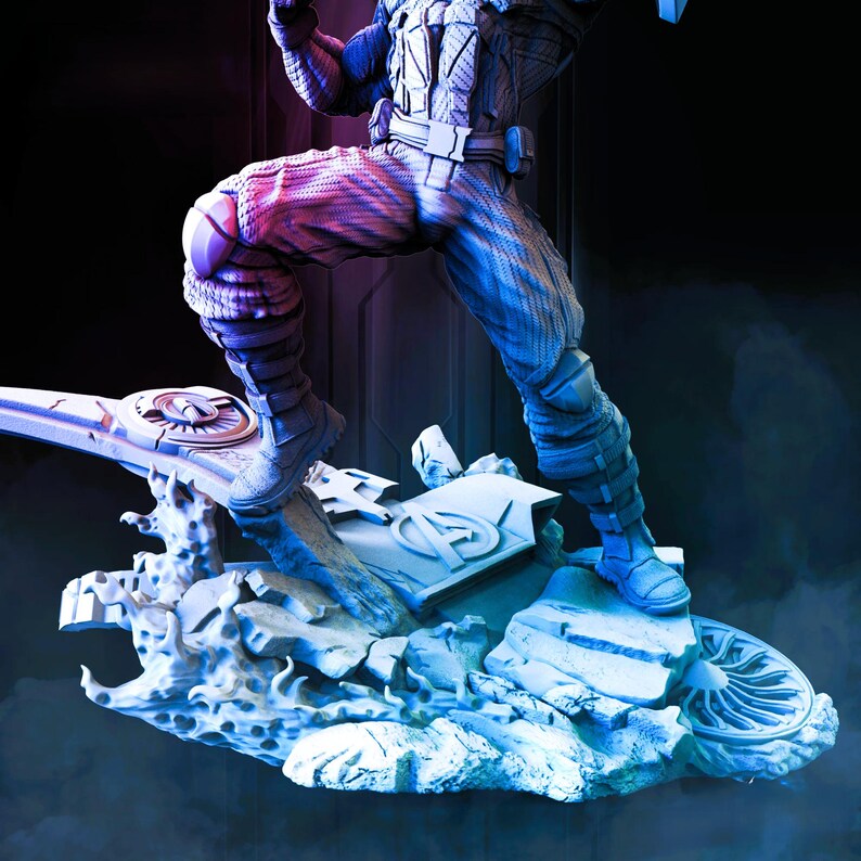 May include: A detailed figurine of a superhero in a dynamic pose, clad in a blue, white, and red costume. The figure is standing on a sculpted base with the Avengers logo. The color palette includes shades of blue, red, and white.